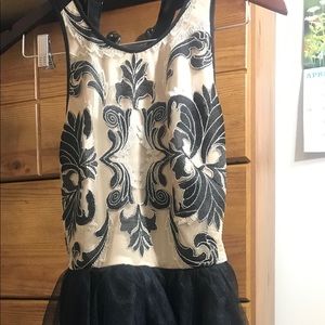 Nude and black cocktail dress
